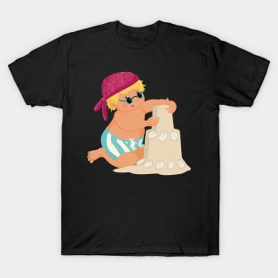 Cute little boy is on vacation building a sand castle on the beach, no background T-Shirt